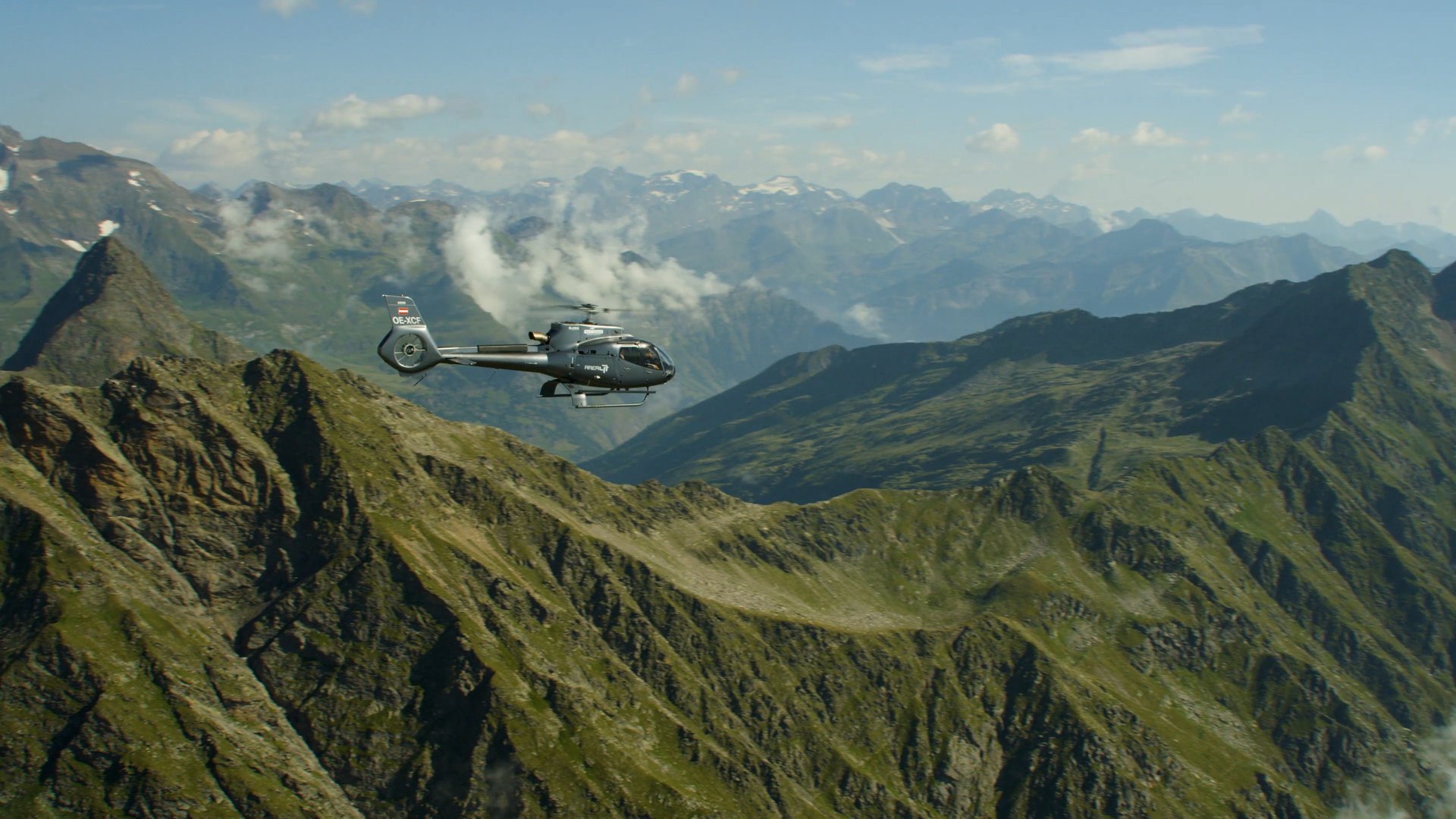 helicopter above mountains