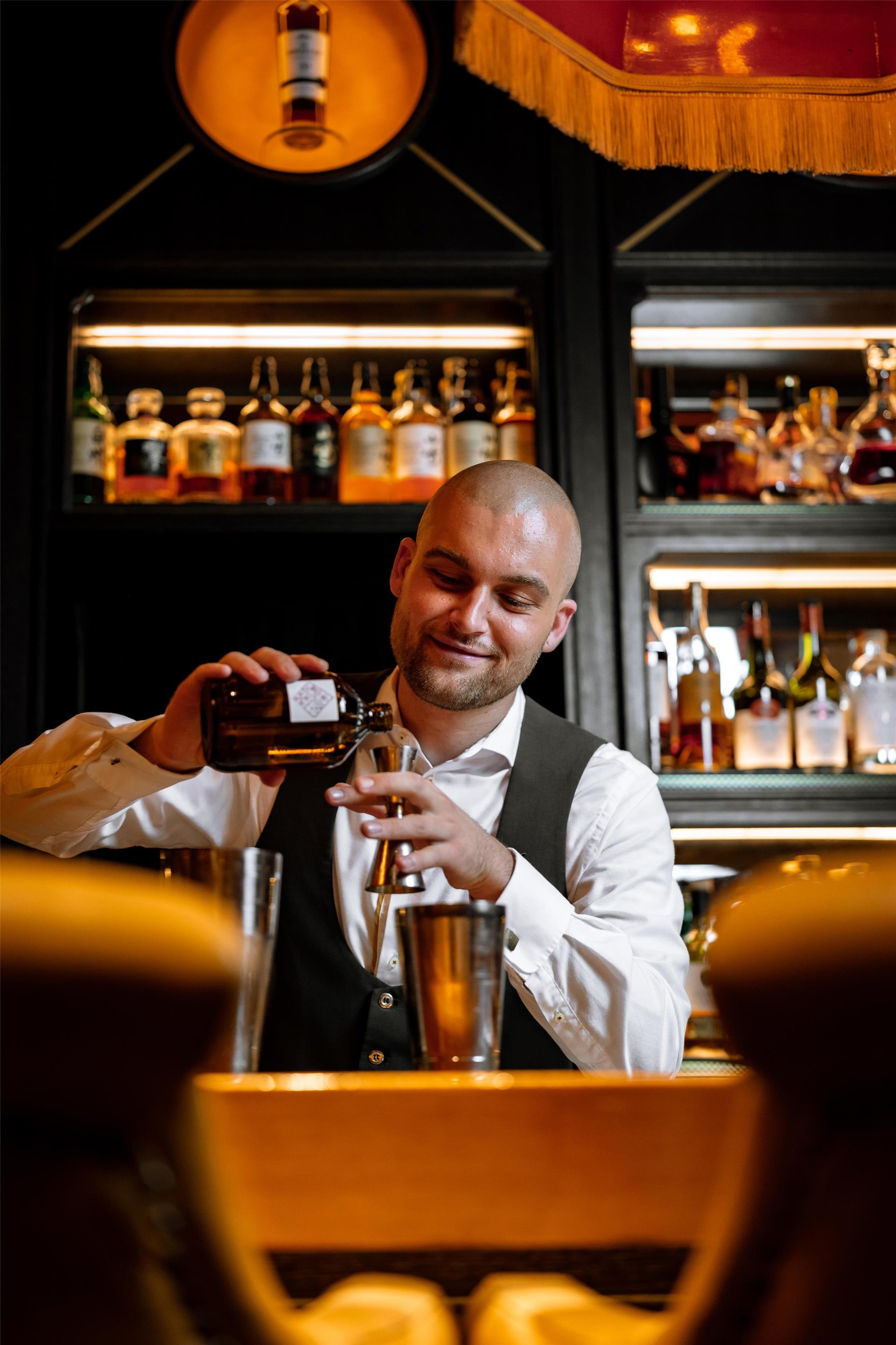 Bar tender at Jahreszeiten Bar, Hotel Vier Jahreszeiten Kempinski