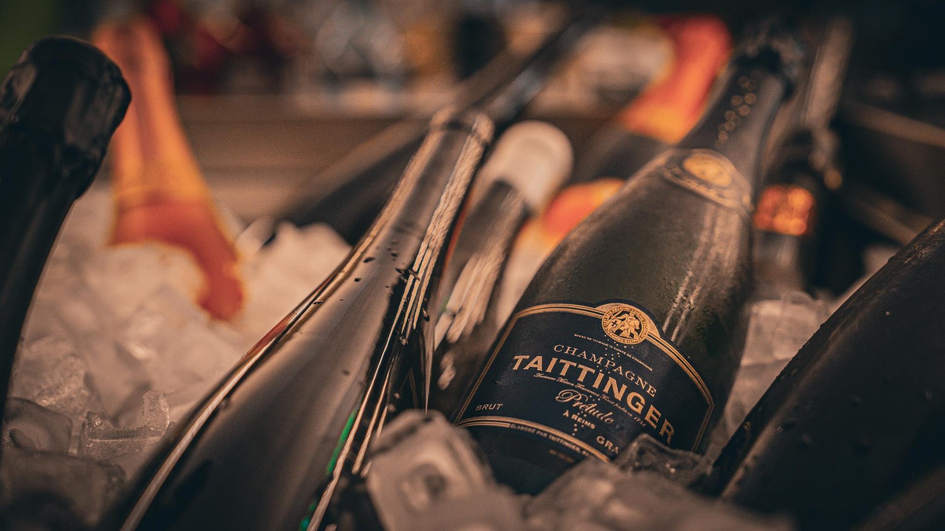 Connoisseurs enjoying fine wines and Taittinger Champagne in Kastenmeier's elegant bar in Dresden.