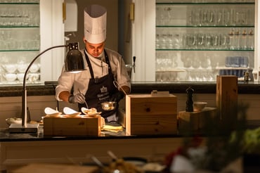 Chef at a live cooking station during the Adlon champagne brunch