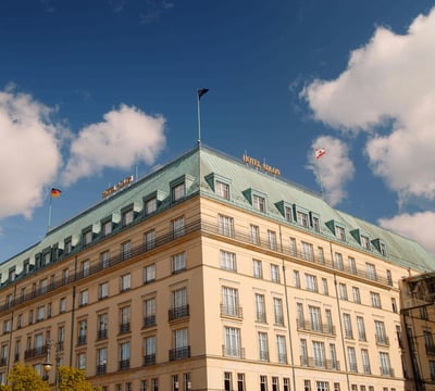 Exterior view of Hotel Adlon Kempinski Berlin with blue sky
