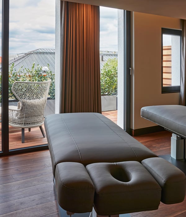 Serene wellness treatment room at Kempinski The Spa, Hotel Vier Jahreszeiten Kempinski München