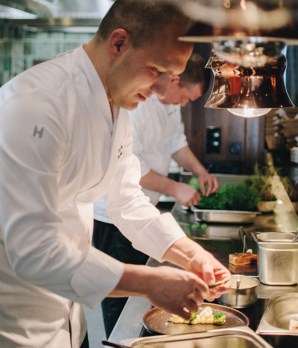 Chefs cooking at Come Prima live kitchen